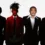 Jaden Smith at Louboutin announced as Creative Director , standing in a bold red jacket next to Christian Louboutin.