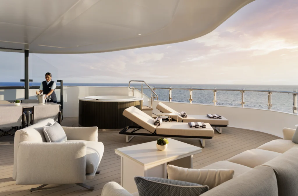 Luxury yacht deck with lounge chairs, jacuzzi, ocean views, and personalized service at sunset.