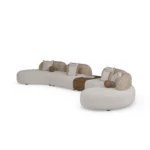 Mela luxury sofa by Nolita Harbour, curved bouclé sectional with integrated wood console and soft, flowing silhouette.