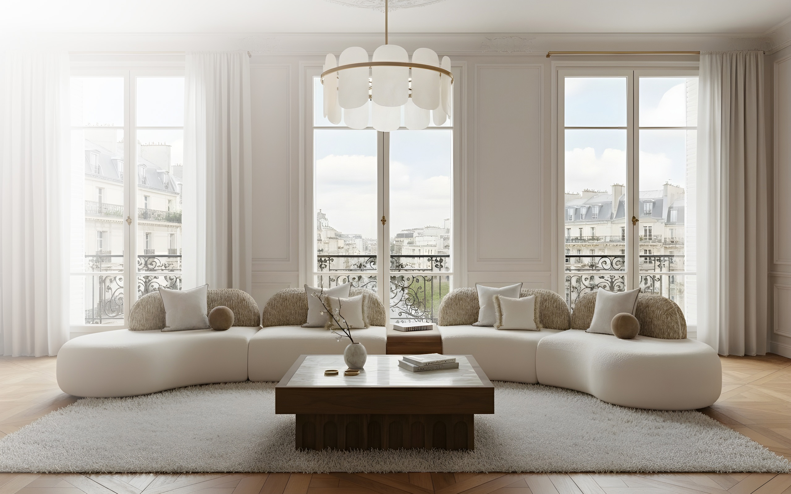 Bright modern living room with large curved white sectional sofa, wooden coffee table, soft neutral decor, and tall French windows overlooking a cityscape.