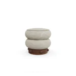 Calie Stool by Nolita Harbour, sculptural seating stool crafted in patterned velvet and matte walnut wood, defined by two rounded organic volumes inspired by natural stone formations, with a textured surface that echoes subtle mineral veining, bringing tactile depth and calm elegance to luxury interior design spaces.