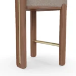 Diane contemporary bar chair detail by Nolita Harbour, bouclé upholstered stool with warm walnut legs and graceful curved silhouette.
