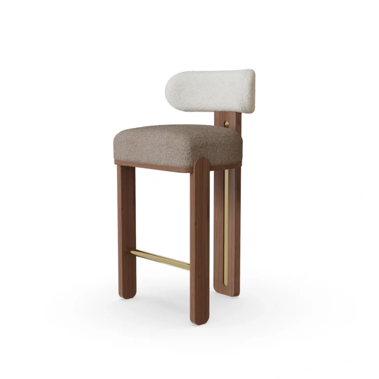 Diane bar chair by Nolita Harbour, bouclé bar stool with walnut base and brass details, sculptural curved-back design.