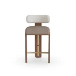 Diane bar stool by Nolita Harbour, bouclé upholstered chair with curved back, walnut base, and refined brass detailing.