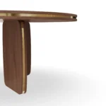 Assia Round Dining Table, an organic dining table by Nolita Harbour in stone and solid wood, with a warm architectural base.
