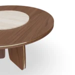 Assia Round Dining Table, a contemporary dining table by Nolita Harbour in stone and wood, featuring soft curves and calm form.
