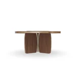 Assia Round Dining Table, a sculptural dining table by Nolita Harbour in stone and wood, with balanced organic curves.