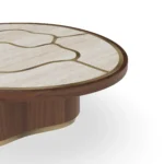 Calienne Coffee Table by Nolita Harbour, a contemporary coffee table with a stone surface, walnut base, and brass inlay.