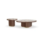 Calienne Coffee Table by Nolita Harbour, a stone and walnut coffee table with flowing brass inlay and sculpted base.