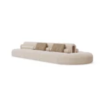 Malora designer sofa by Nolita Harbour, fabric curved sofa with modular layout and sculptural, elegant profile.