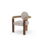 Maudine dining chair by Nolita Harbour, upholstered chair with circular backrest, walnut legs, and brass detailing.