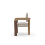 Maudine contemporary dining chair by Nolita Harbour, patterned upholstered seat with sculptural back and walnut frame.