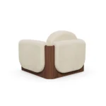 Noah designer armchair by Nolita Harbour, luxury accent chair with enveloping arms and warm architectural wood detailing.