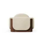 Noah upholstered armchair by Nolita Harbour, luxury lounge chair with curved back, enveloping arms, and warm wood base.