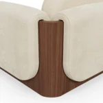Noah luxury armchair by Nolita Harbour, upholstered chair with soft curves, architectural wood structure, and generous comfort.