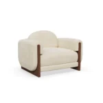Noah armchair by Nolita Harbour, upholstered armchair with wood frame and sculptural rounded silhouette.