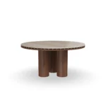 Roselle Dining Table, a refined dining table by Nolita Harbour that combines stone top, walnut base, and brass accents.