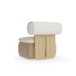 Galène armchair by Nolita Harbour, sculptural upholstered armchair with cylindrical backrest, rounded seat, and refined wood detailing.