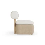 Galène armchair by Nolita Harbour, sculptural upholstered armchair with rounded seat, cylindrical backrest, and elegant side profile.
