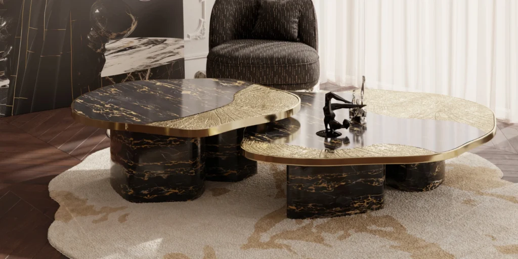 Sculptural black marble coffee tables with gold detailing in a luxury living room, showcasing refined craftsmanship and contemporary marble furniture design.