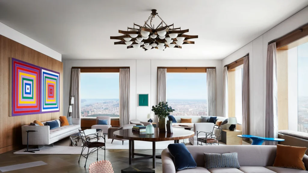 Modern New York luxury residence with custom kitchen island, refined material palette, and panoramic urban views, illustrating a design-first approach to luxury real estate.