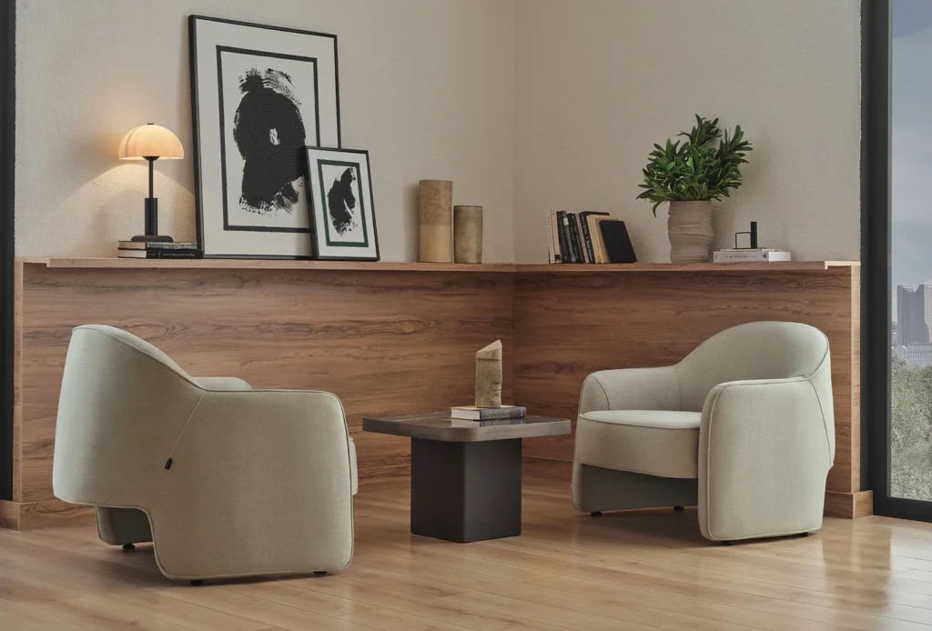 Sophisticated living room with curved modern armchairs upholstered in neutral fabric, creating a sculptural seating arrangement that balances comfort and architectural elegance.