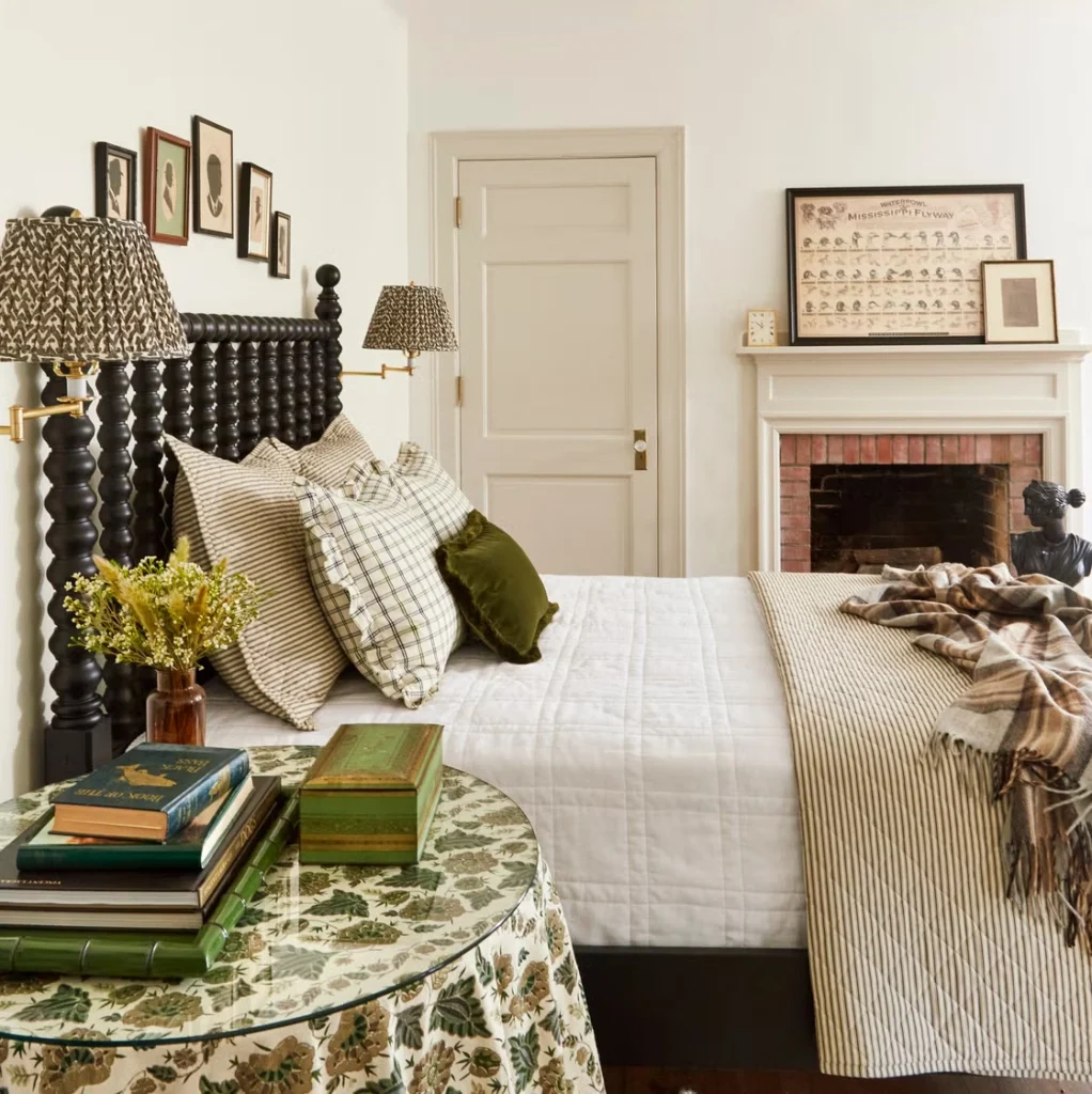 Luxury guest bedroom design showcasing layered furniture beyond the bed, including upholstered benches, armchairs, integrated storage, statement lighting, and refined material textures in architecturally designed interiors.