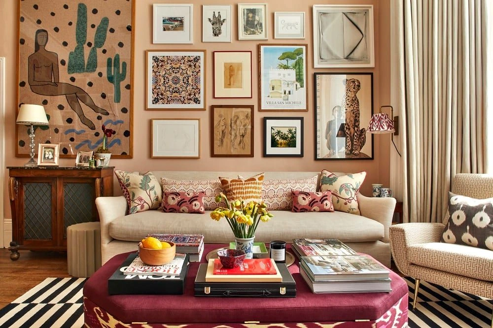 Eclectic living room combining antique cabinetry, contemporary sofa, and curated art wall for a layered yet timeless interior design