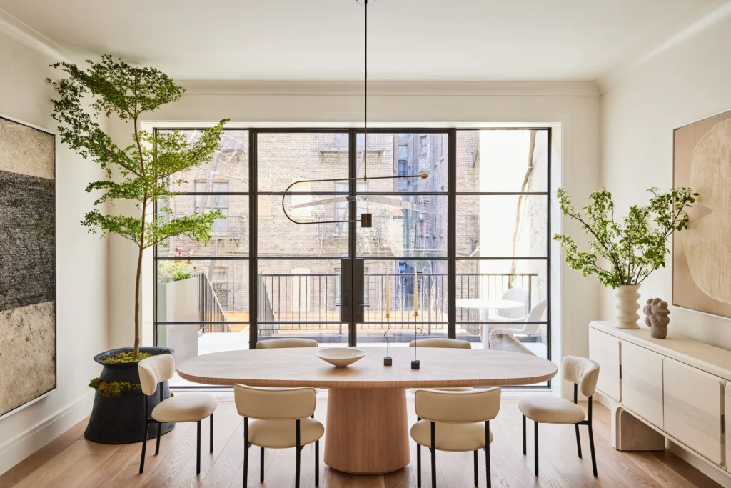 Elegant contemporary dining interiors featuring upholstered dining chairs in neutral and deep tones, sculptural wooden and marble tables, refined lighting, and layered textures that highlight comfort, craftsmanship, and luxury design.