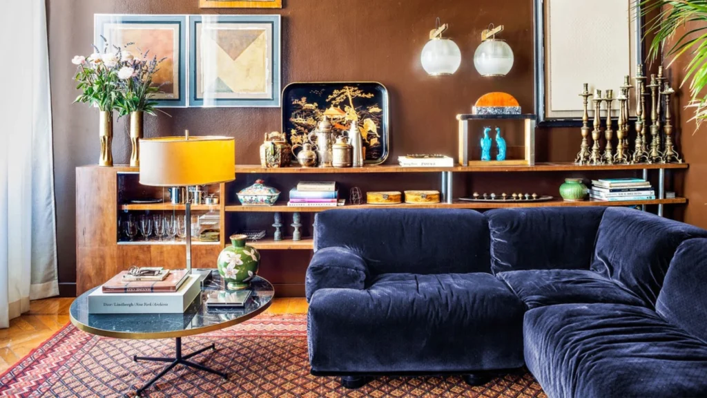 Dimore Studio atmospheric interior design with maximalist layered luxury interiors, velvet furniture, vintage lighting and moody Milanese aesthetic