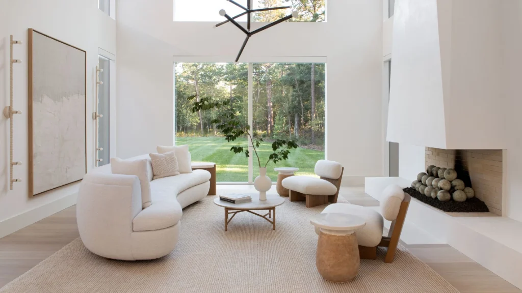 Axel Vervoordt minimalist luxury interiors featuring neutral interiors, textured plaster walls, natural stone floors, reclaimed wood, linen furnishings, and serene wabi-sabi inspired architectural spaces filled with soft natural light.