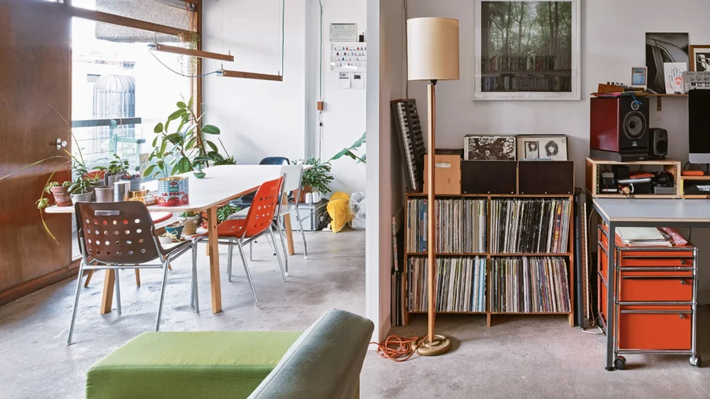 Barbican Estate brutalist apartments in London featuring split-level interiors, concrete architecture, landscaped terraces, and iconic modernist towers.