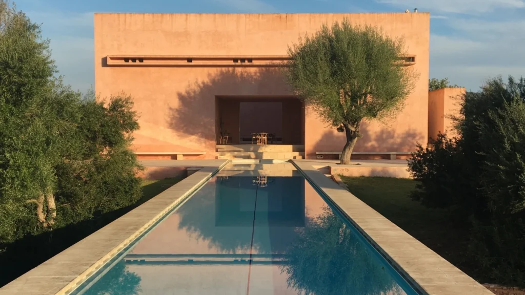 Claudio Silvestrin warm minimalist interiors featuring natural stone, soft light, and refined architectural spaces that define contemporary minimalist luxury homes.
