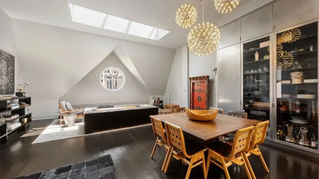 Luxury Tribeca duplex apartments featuring double-height living rooms, sculptural staircases, mezzanine galleries, and refined Tribeca loft interiors demonstrating sophisticated duplex apartment layout design.