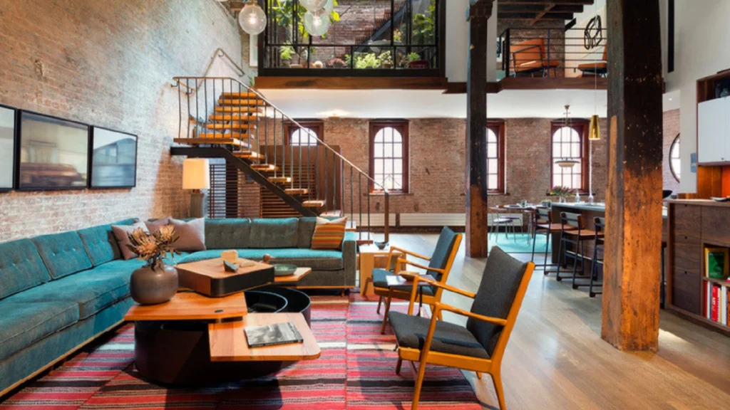 Luxury Tribeca duplex apartments featuring double-height living rooms, sculptural staircases, mezzanine galleries, and refined Tribeca loft interiors demonstrating sophisticated duplex apartment layout design.