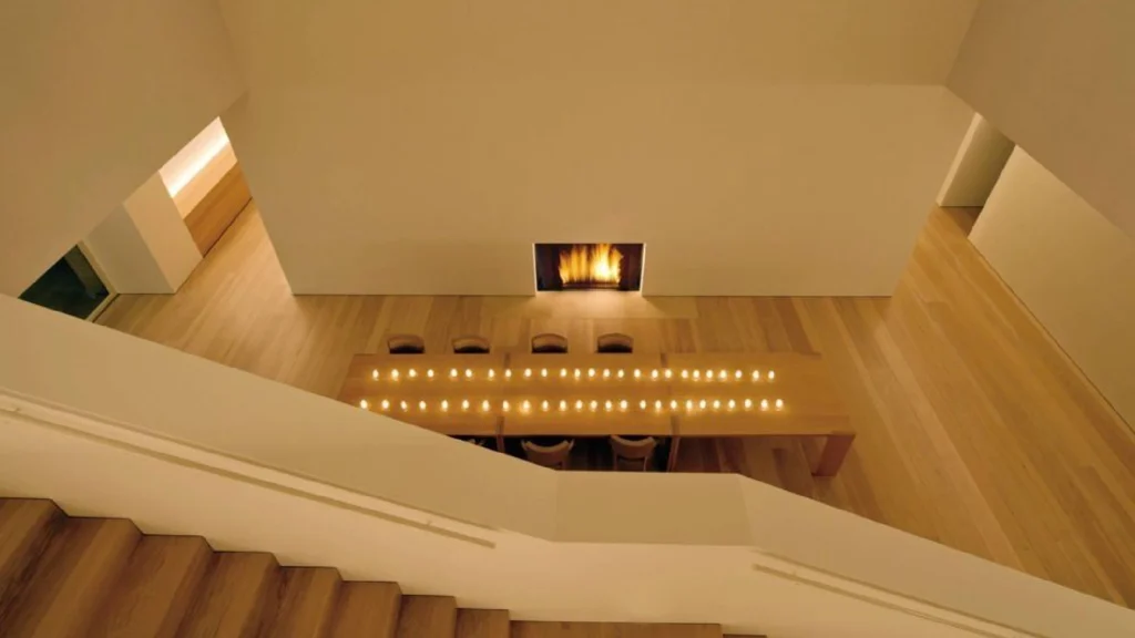 Serene minimalist interiors inspired by John Pawson featuring natural materials, architectural light, and calm contemporary spatial design.