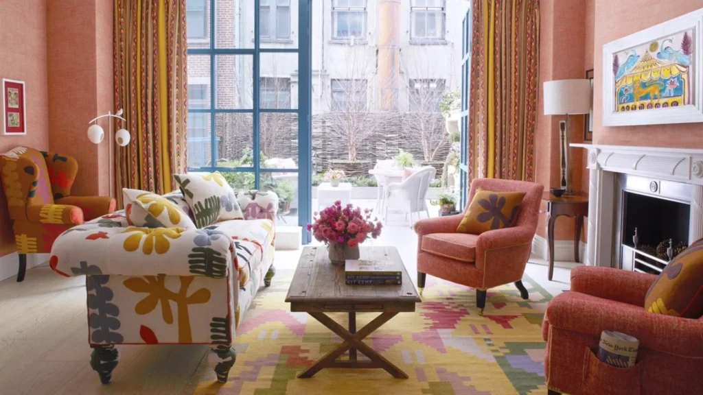 Pattern-rich and layered interior spaces inspired by Kit Kemp’s British interior design style featuring vibrant textiles, bold colors, and eclectic decorative elements.