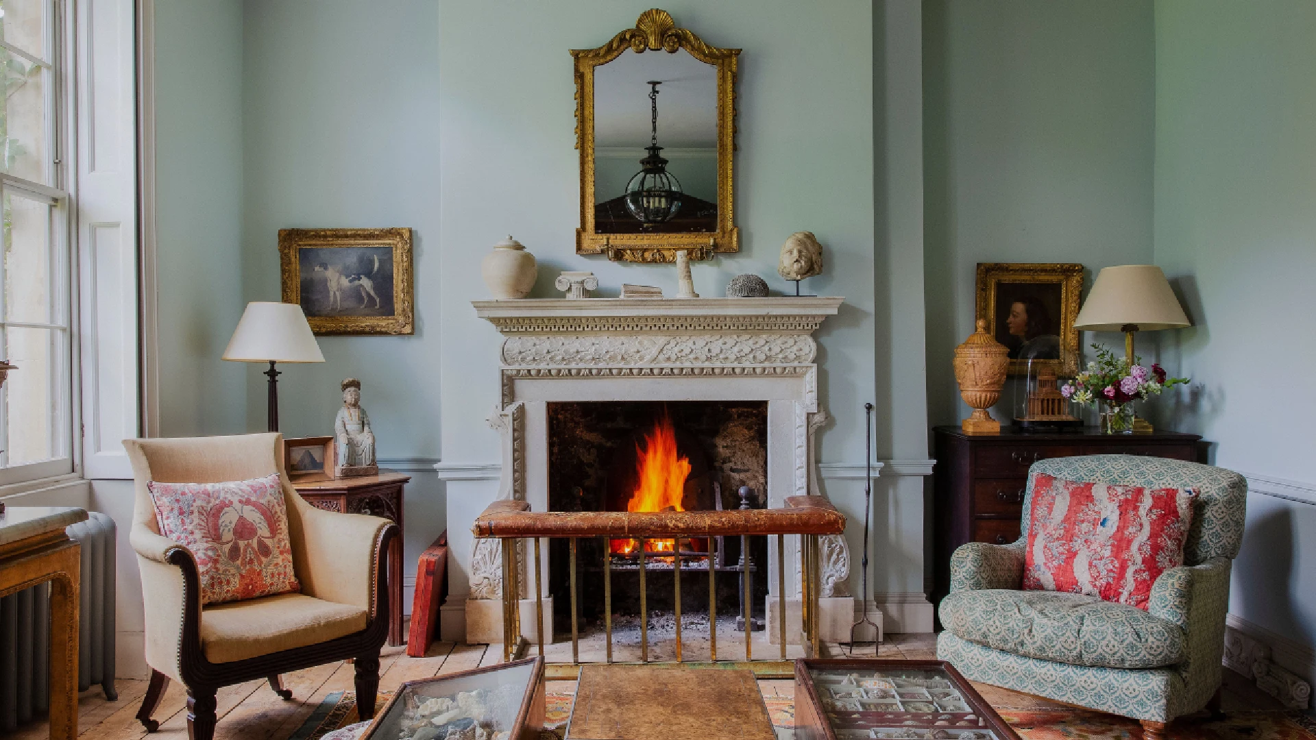 Luxury interior design comparison showing period home interior design with tall ceilings, ornate moldings and grand furnishings versus modern luxury apartment interiors with low-profile furniture and open-plan layouts.