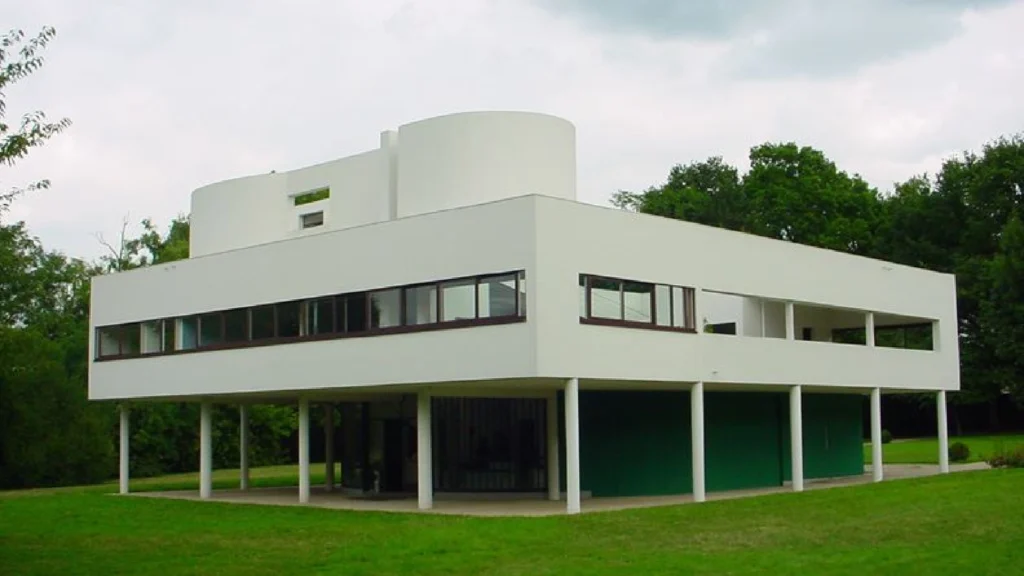 Villa Savoye by Le Corbusier in Poissy, France, iconic example of modernist architecture featuring white facade, ribbon windows, pilotis columns, and minimalist modernist design.