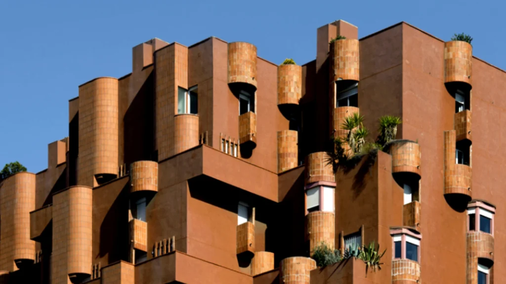 Walden 7 residential complex by Ricardo Bofill in Barcelona, a landmark of postmodern residential architecture featuring terracotta towers and vibrant interior courtyards.