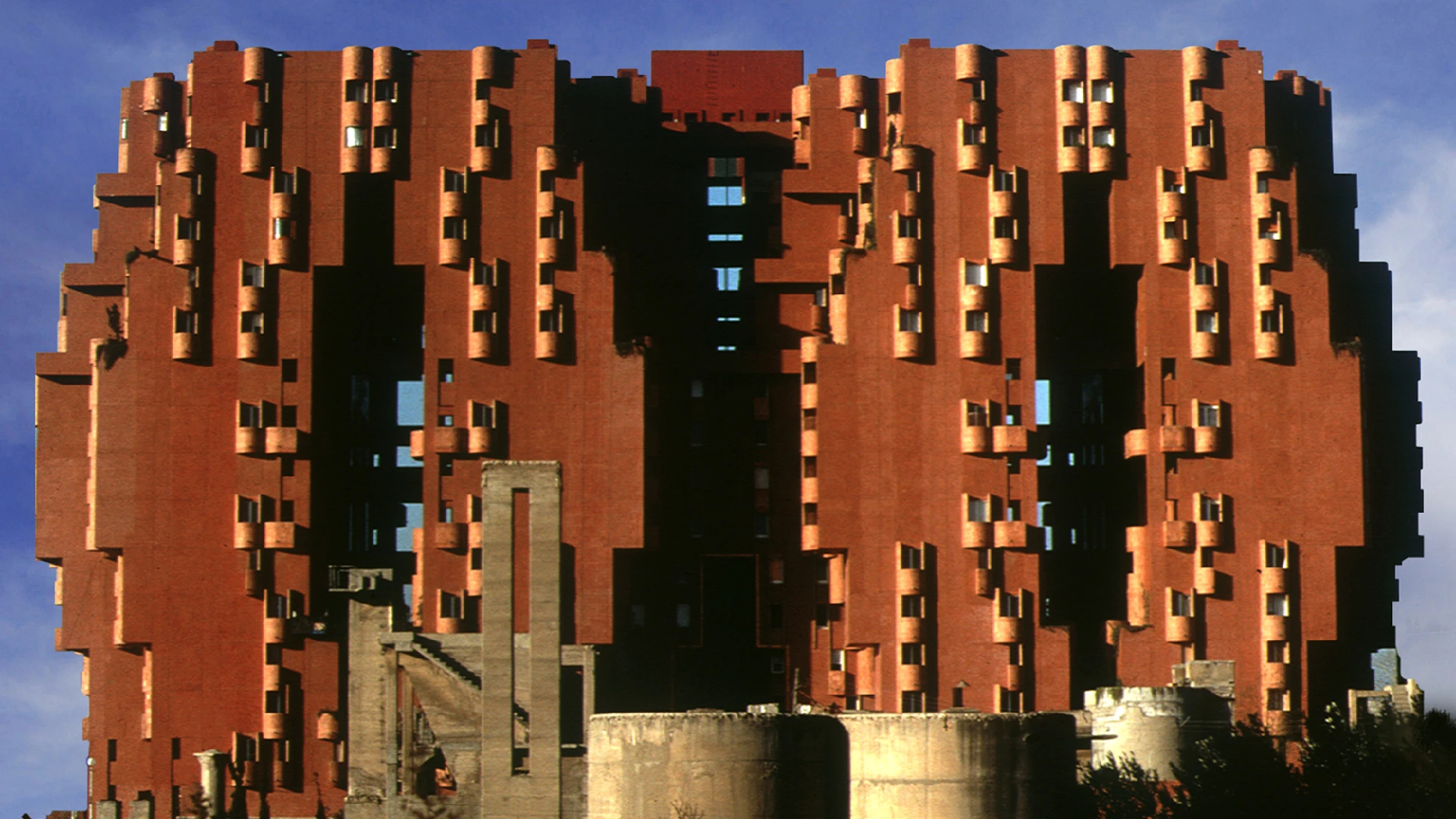 Walden 7 residential complex by Ricardo Bofill in Barcelona, a landmark of postmodern residential architecture featuring terracotta towers and vibrant interior courtyards.