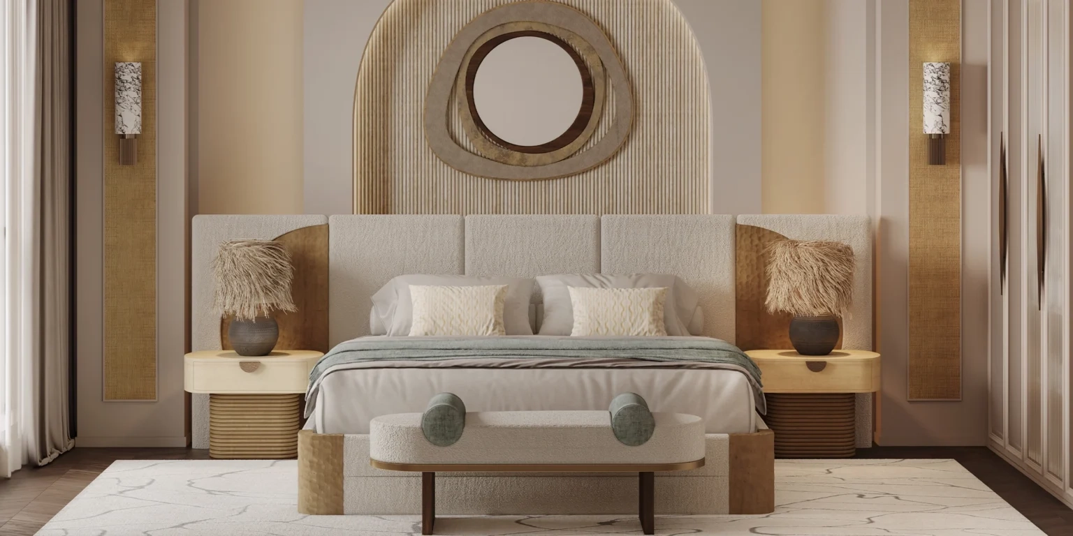 A high-end bedroom featuring the Claude bed by Nolita Harbour, neutral bedding, a round mirror above the headboard, two nightstands with decorative lamps, and a cushioned bench.