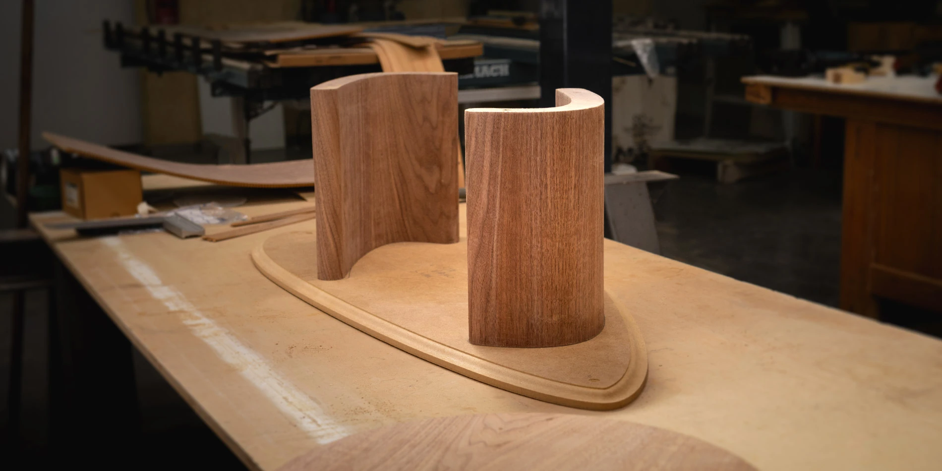 Assembly of the wooden components of a bespoke coffee table, at Nolita Harbour's workshop, highlighting craftsmanship and quality in luxury furniture.