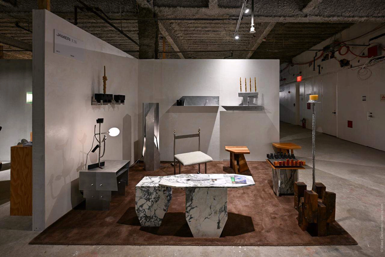 Outdoor design fair scene featuring modern exhibition setup, visitors, and urban environment, representing luxury design fairs and global design culture