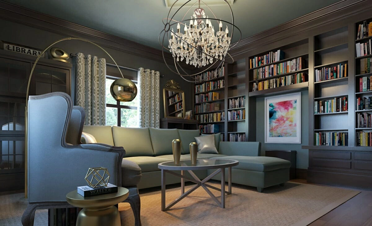 Luxurious home library with a plush sectional sofa, elegant chandelier, and walls lined with books. 